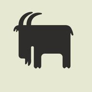 Silhouette of goat with horns standing sideways