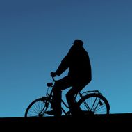 Old man bicycling