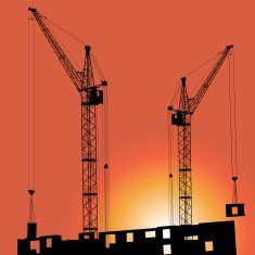 Silhouettes of crane on building