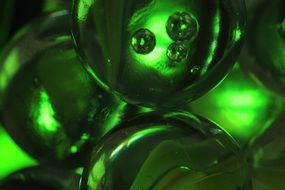 green marbles glass balls macro