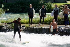 surfing Men on river waves