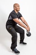 happy asian man making weight exercises