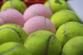 Pink and green tennis balls