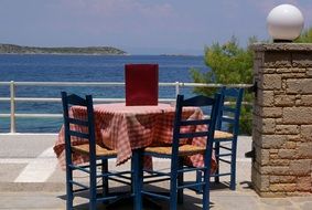 table on a terrace in a tavern on a greek island
