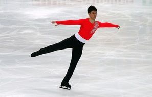 skater in a bright suit on the ice