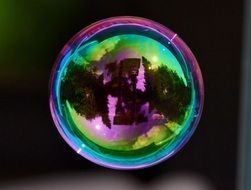 Colorful soap bubble with a mirror image