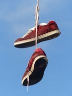 red shoes sneakers hanging