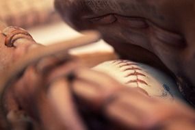 ball in a baseball glove closeup