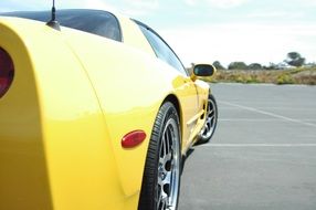 side of a yellow sports car