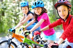 children ride bicycles