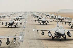 a lot of military aircraft on the runway