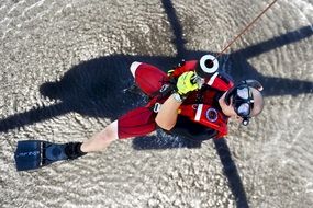 View from the helicopter to the rescue swimmer