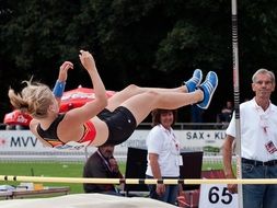 athlete falls on mats after a jump