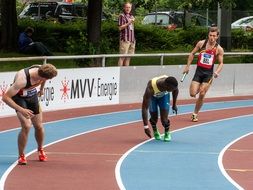Athletes runners in the relay race