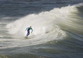 fast surfer on the crest of a wave