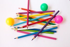 colorful pencils near the balls