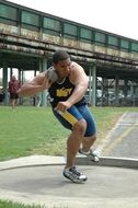 shot putter, male athlete throwing ball