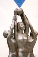 statue of women with the ball