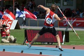 athlete throws a spear
