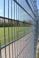 metal grill along the football field