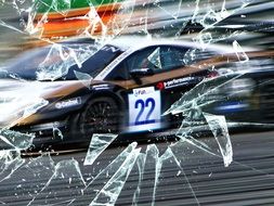 behind broken glass race car number 22