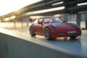 red porsche as a miniature model