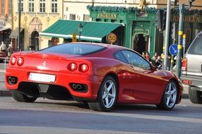 Rear view of red Ferrari on the street