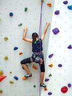 girl climbs up the wall