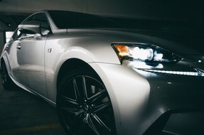 silver sport car in the dark