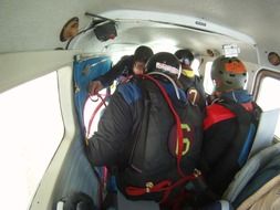 men are preparing for a parachute jump