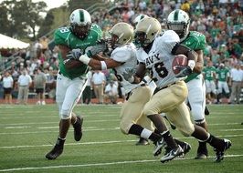 american football players are running