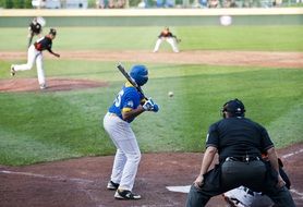 baseball player beats off the serve