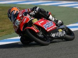 motorcycle racer on a red motorcycle
