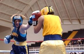 female boxers boxing on ring
