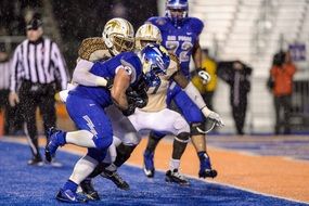 american football runner with a ball