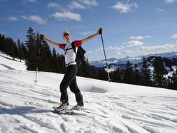 Skier when climbing on a sunny day