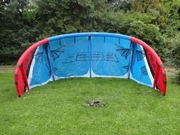 blue parachute on the green grass