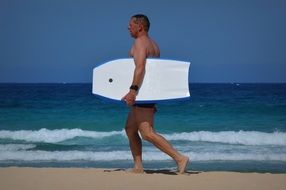 a man with a surfboard