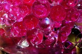 pink glass balls in water