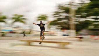 jump over the barrier on a skateboard