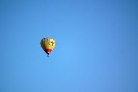 balloon in flight in the blue sky