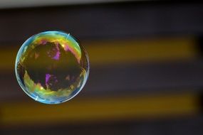 soap bubble near the striped wall