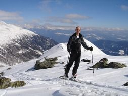 man on a ski trip in high mountains