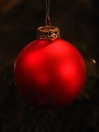 red glass ball for christmas In the dark