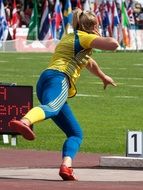 shot put athlete is jumping