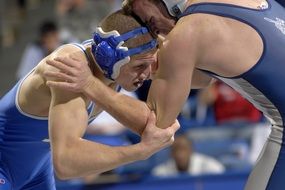 wrestlers in blue vests