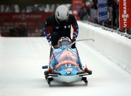 bobsledders on the track