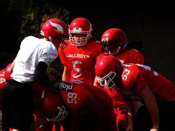 American football team in red helmets