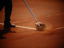 drawing lines on a tennis field