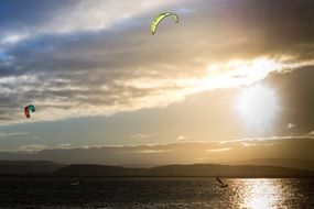 kitesurfing on the lake at sunset